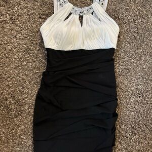 Elegant Black and White Dress with Embellished Neckline